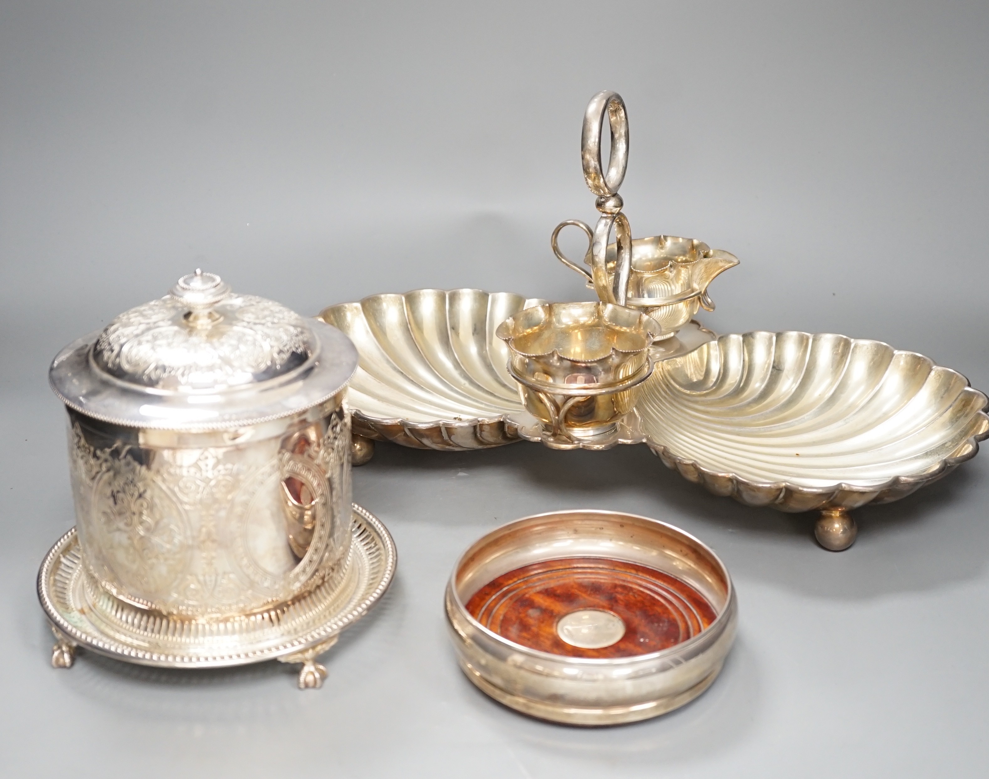 A silver plated strawberry and cream stand with a silver mounted coaster, and a plated biscuit barrel